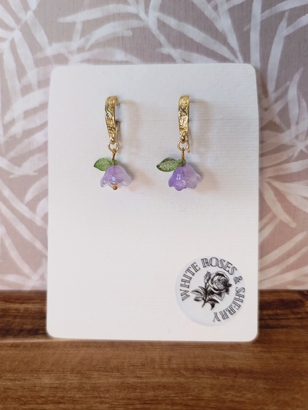 Gold-Plated Purple Flower Drop Earrings with Green Leaf Accents